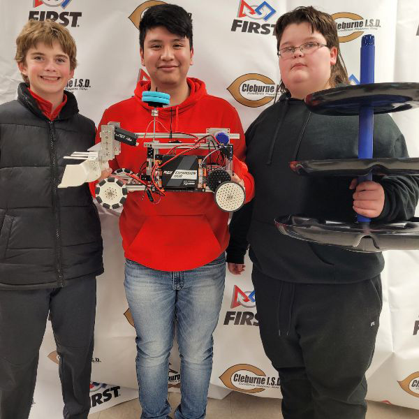  Three students with robotic vehicle 